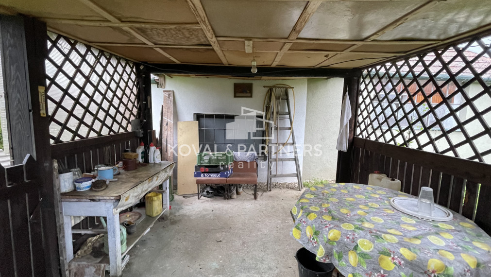 Chatka so záhradou a vinicou - Vráble v časti Horný Dúšnik